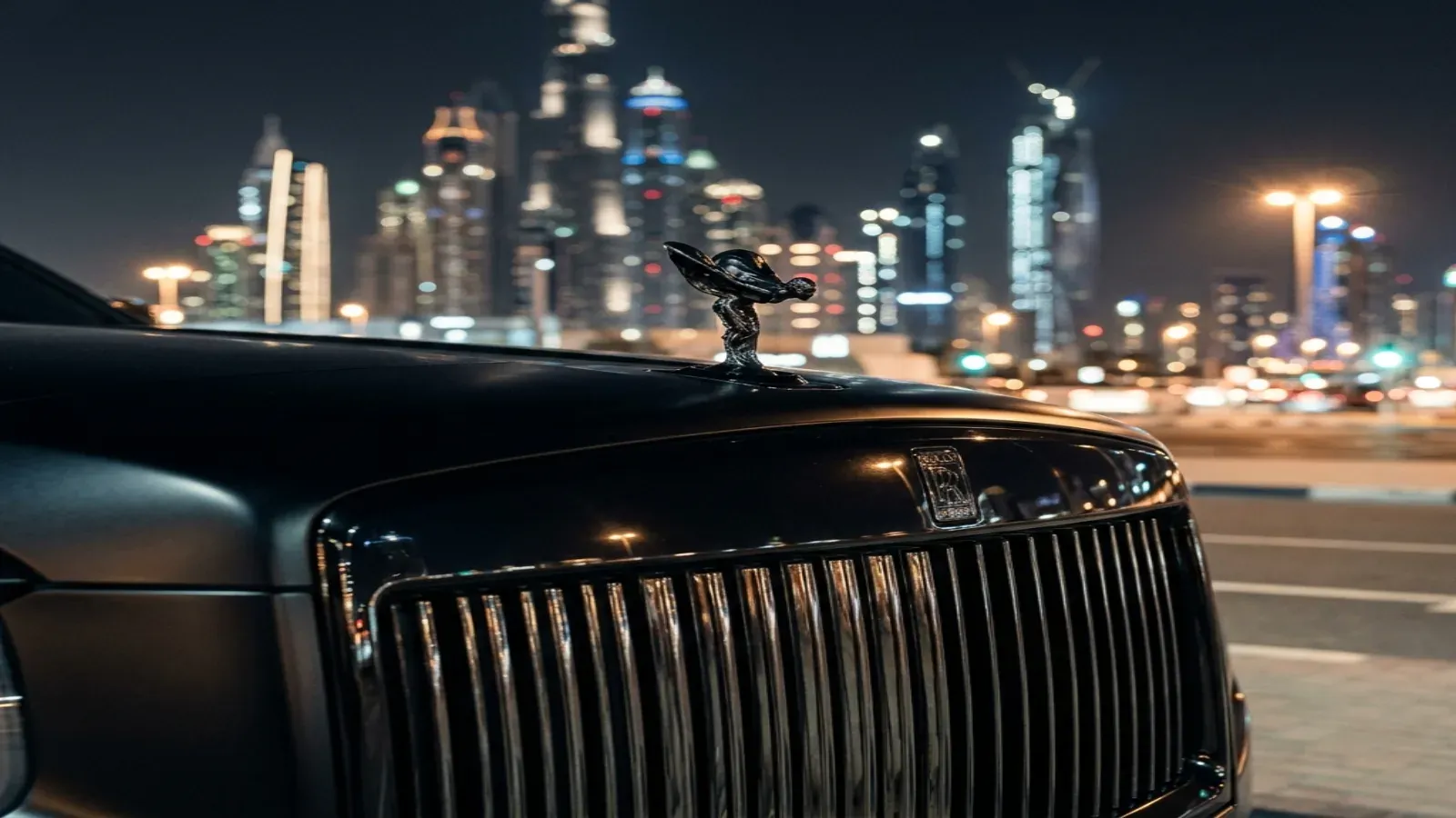 Black 2025 Rolls-Royce Cullinan Black Badge on Sheikh Zayed Road Dubai.