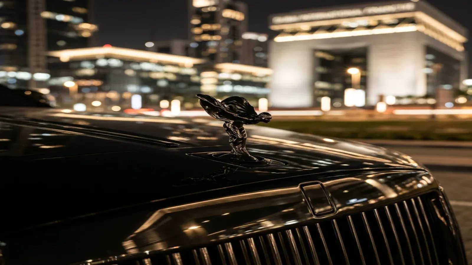 New 2025 Rolls-Royce Ghost Black Badge Series II driving on Sheikh Zayed Road Dubai