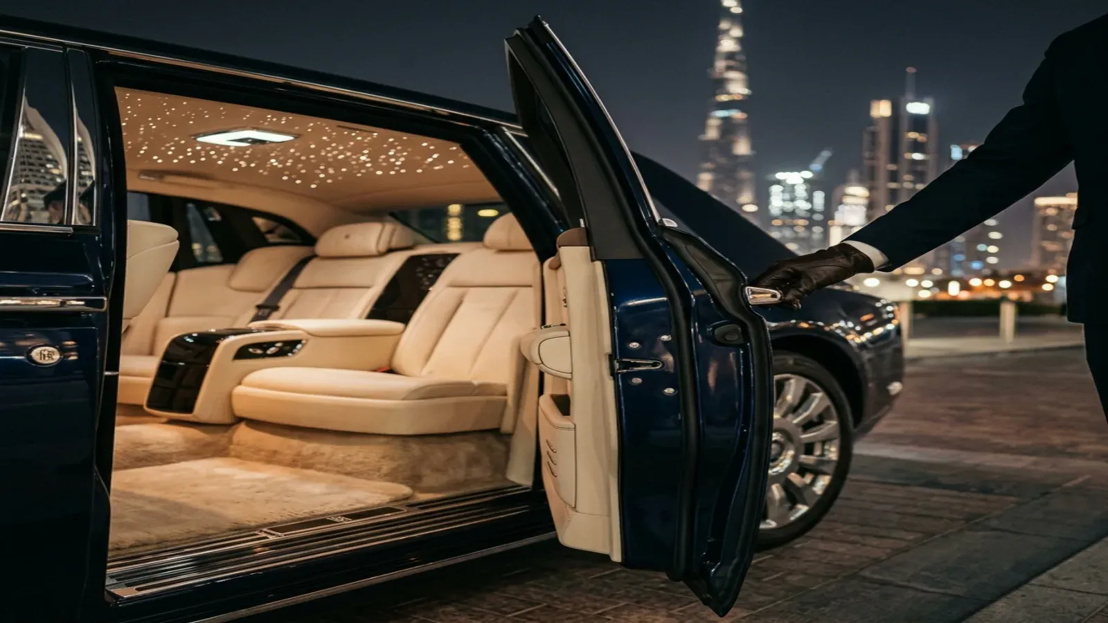 A close-up view of the Rolls-Royce Phantom interior showing the bespoke leather seats, lambswool floor mats, and the Starlight Headliner.