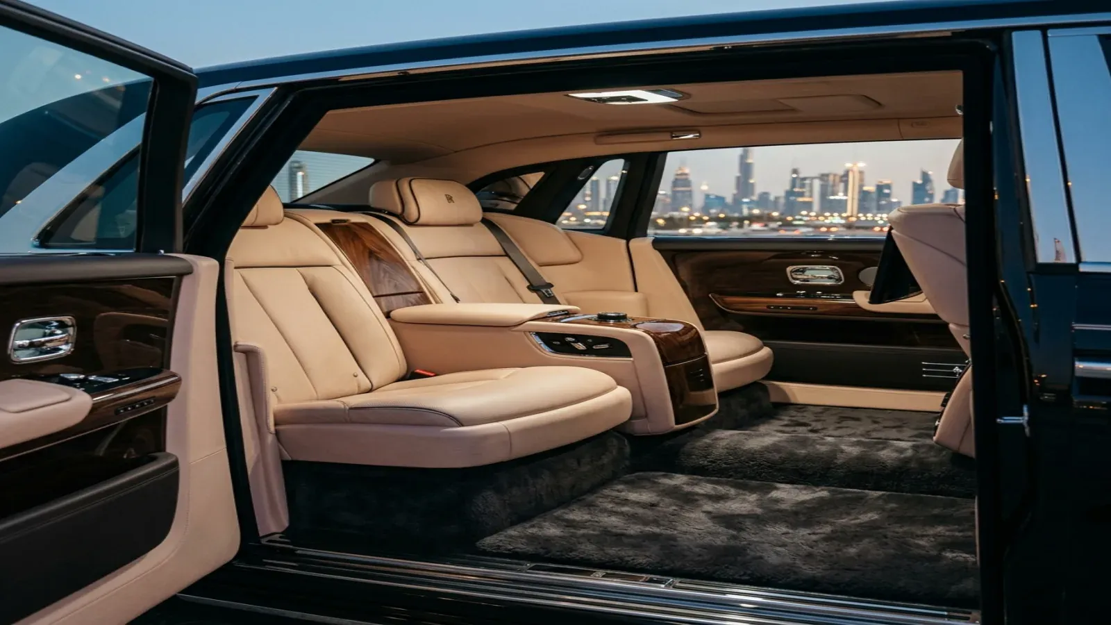 Luxurious leather rear cabin of a Rolls-Royce Phantom showing starlight headliner
