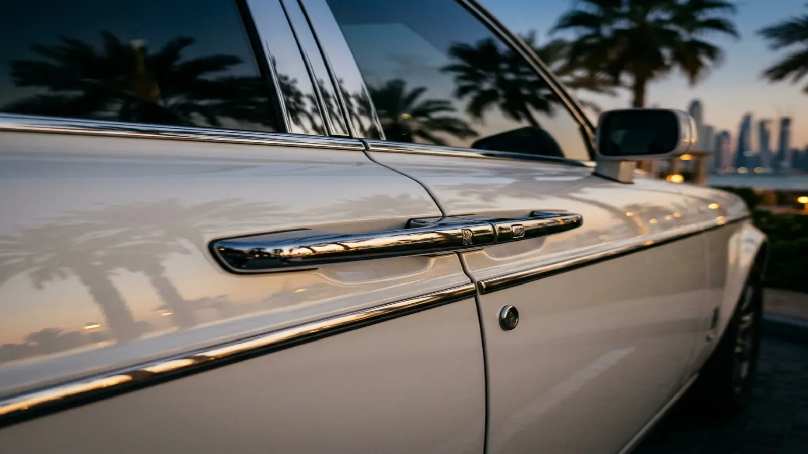 White Rolls-Royce Phantom on the Palm Jumeirah crescent in Dubai.