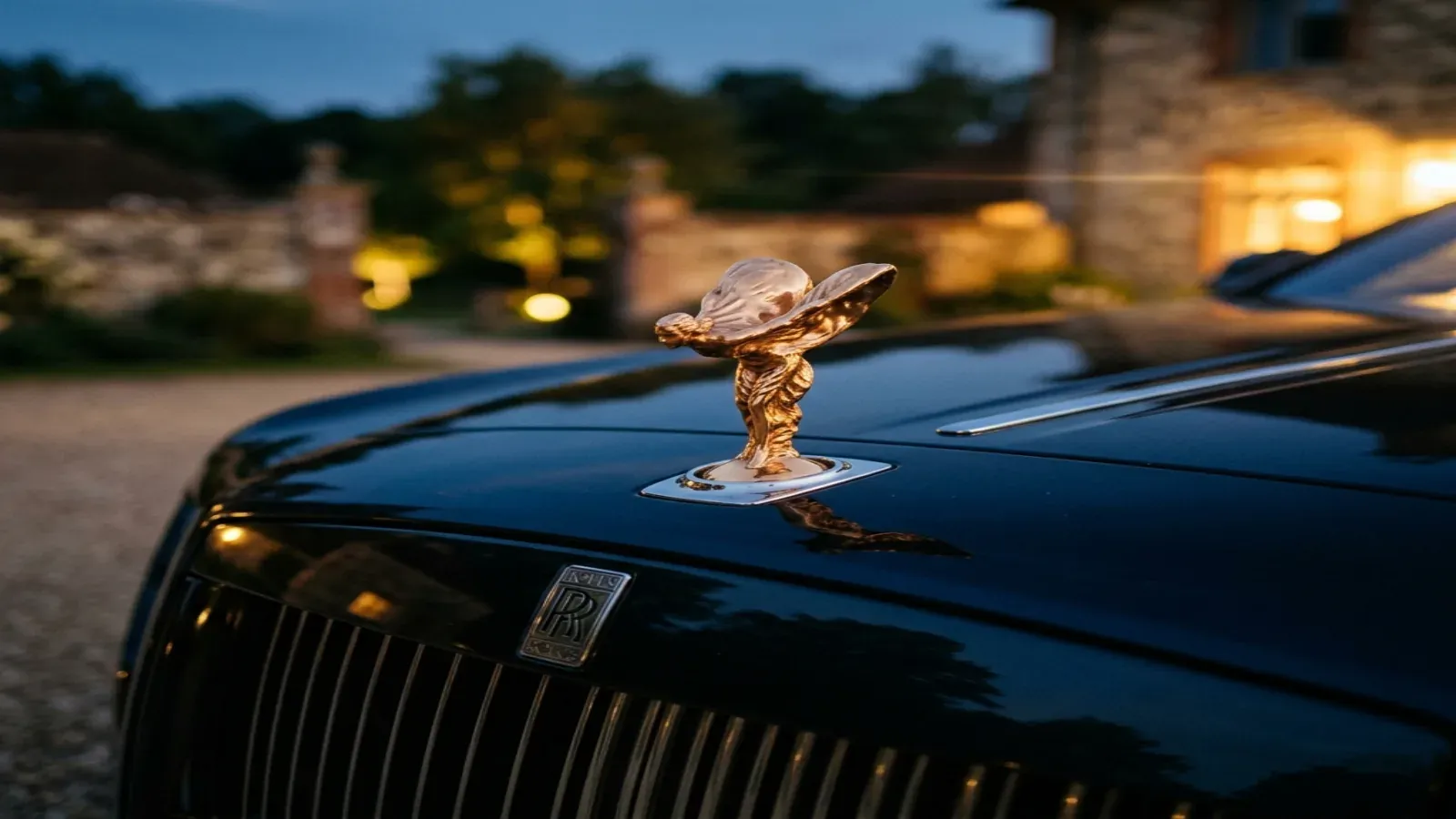 A gorgeous white Rolls-Royce Spectre parked near the Burj Al Arab in Dubai
