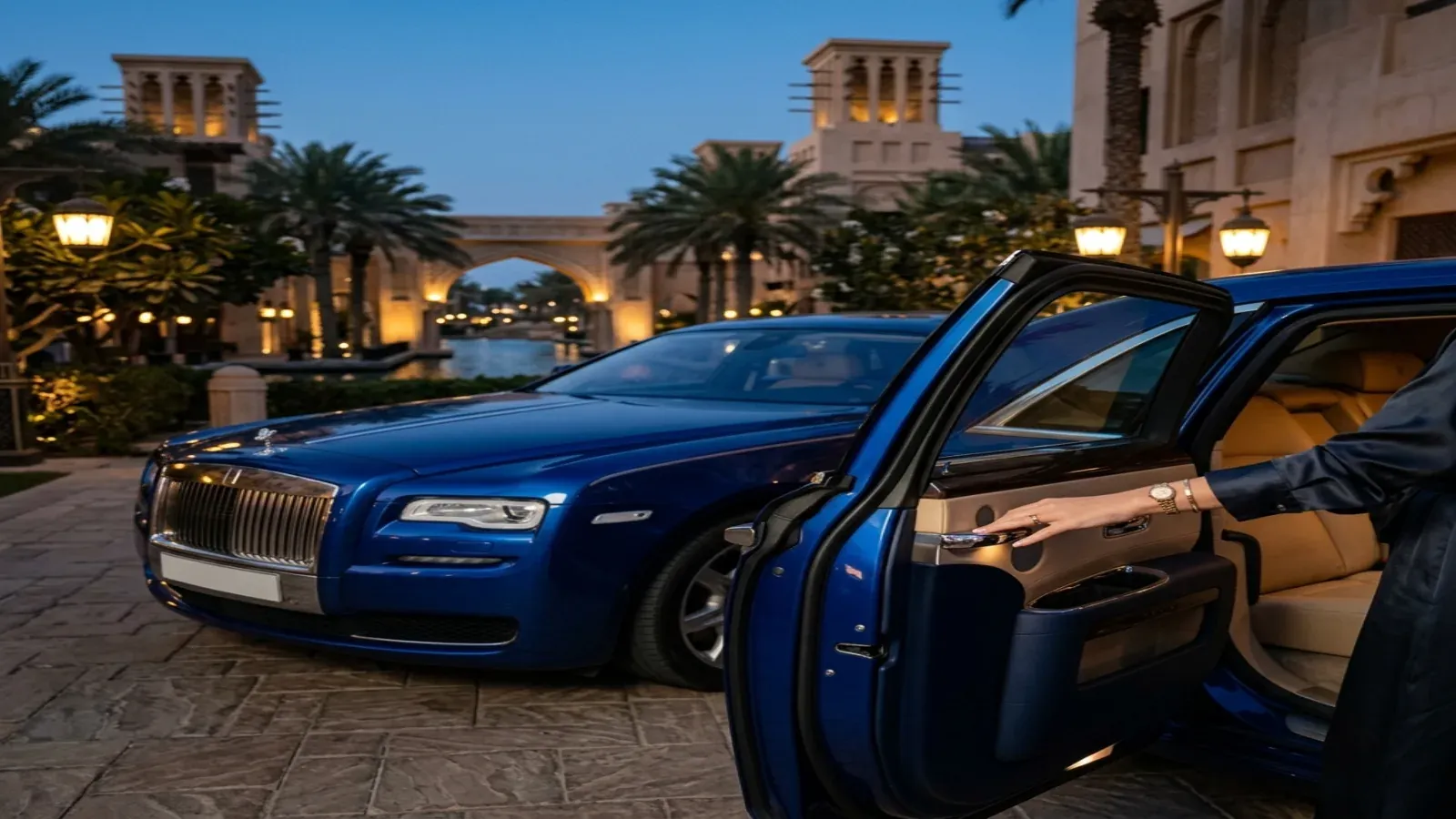 Silver Rolls-Royce Ghost Series II at a Jumeirah hotel forecourt in Dubai.