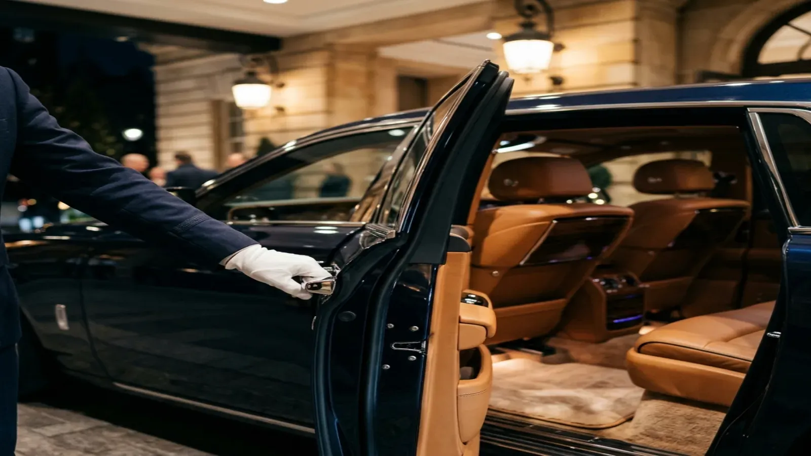 A close-up of a craftsman hand-polishing the spirit of ecstasy on a Rolls-Royce phantom in Dubai