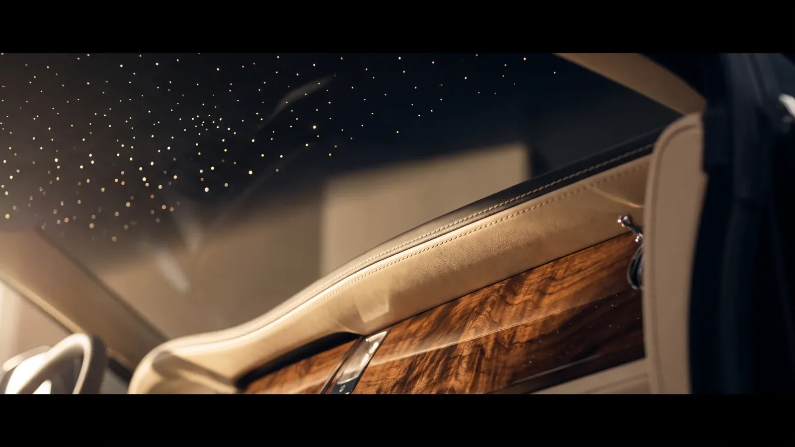 Close-up of a bespoke Rolls-Royce interior detail with starlight headliner and leather