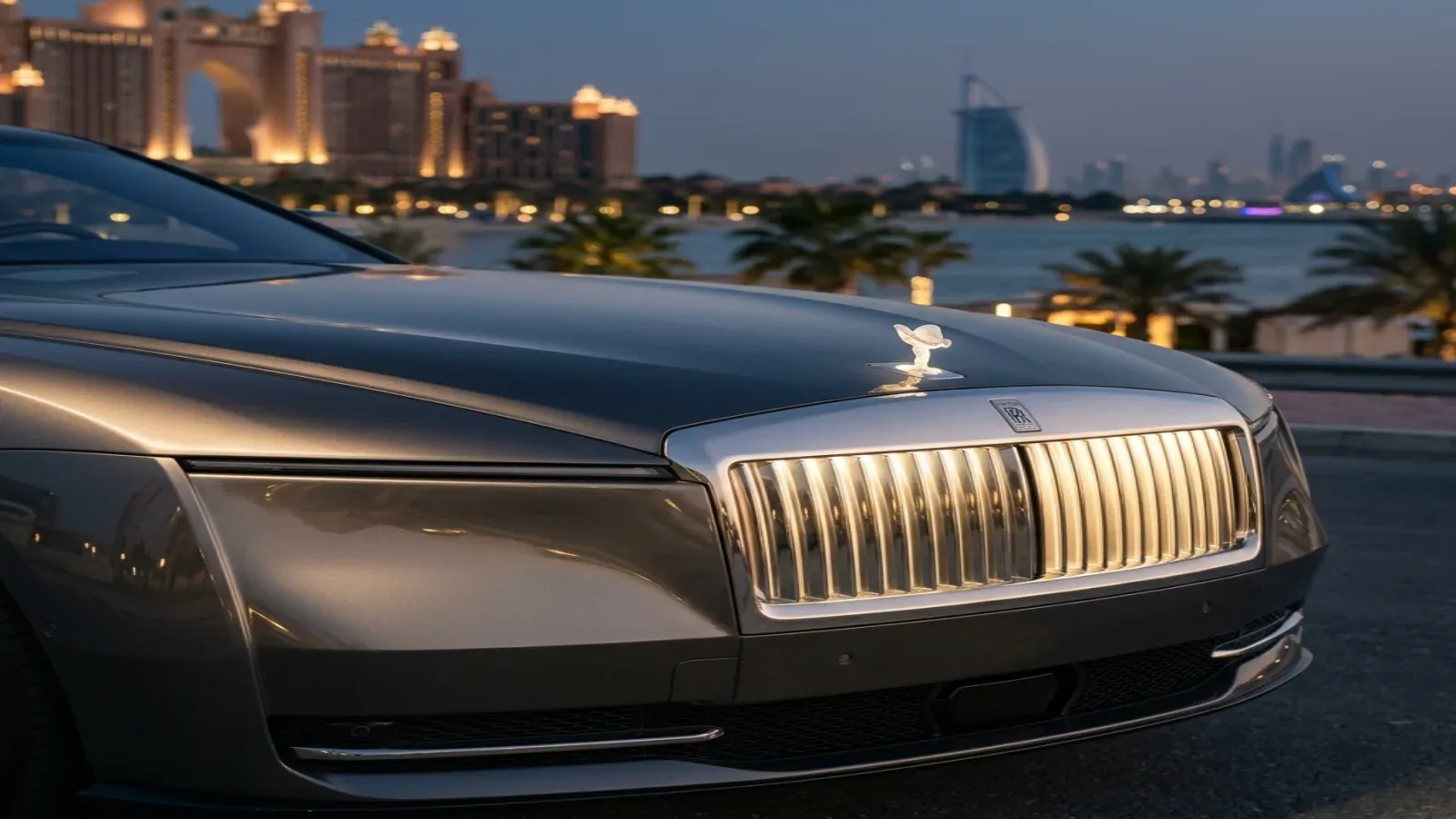 Rolls-Royce Spectre on a scenic road in Dubai at sunset.