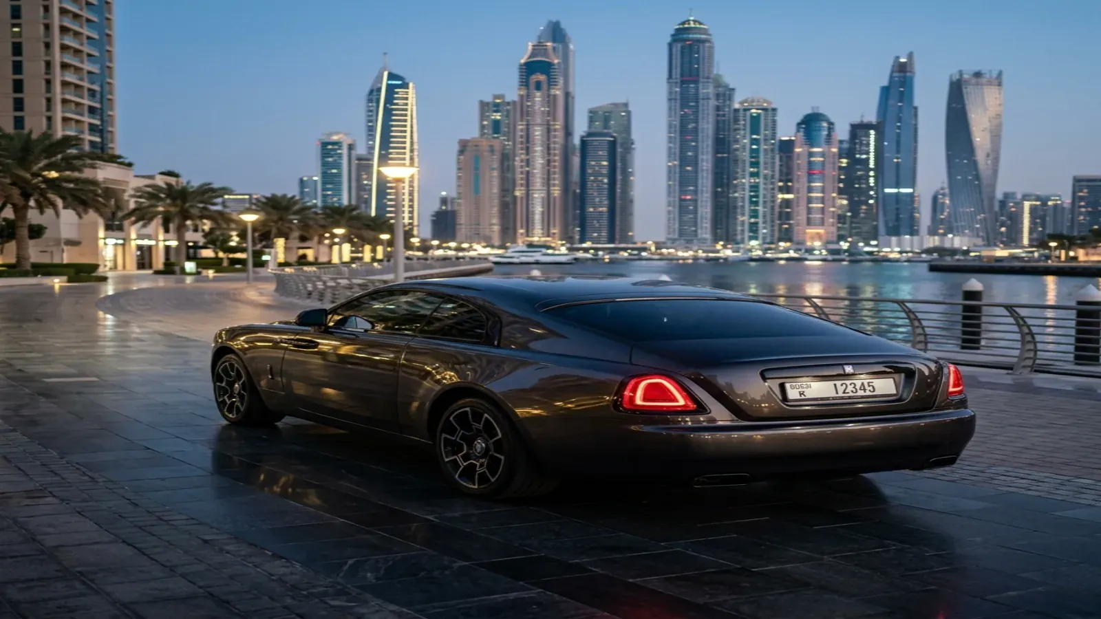 Rolls-Royce Wraith Black Badge parked outside a luxury venue in Downtown Dubai at night